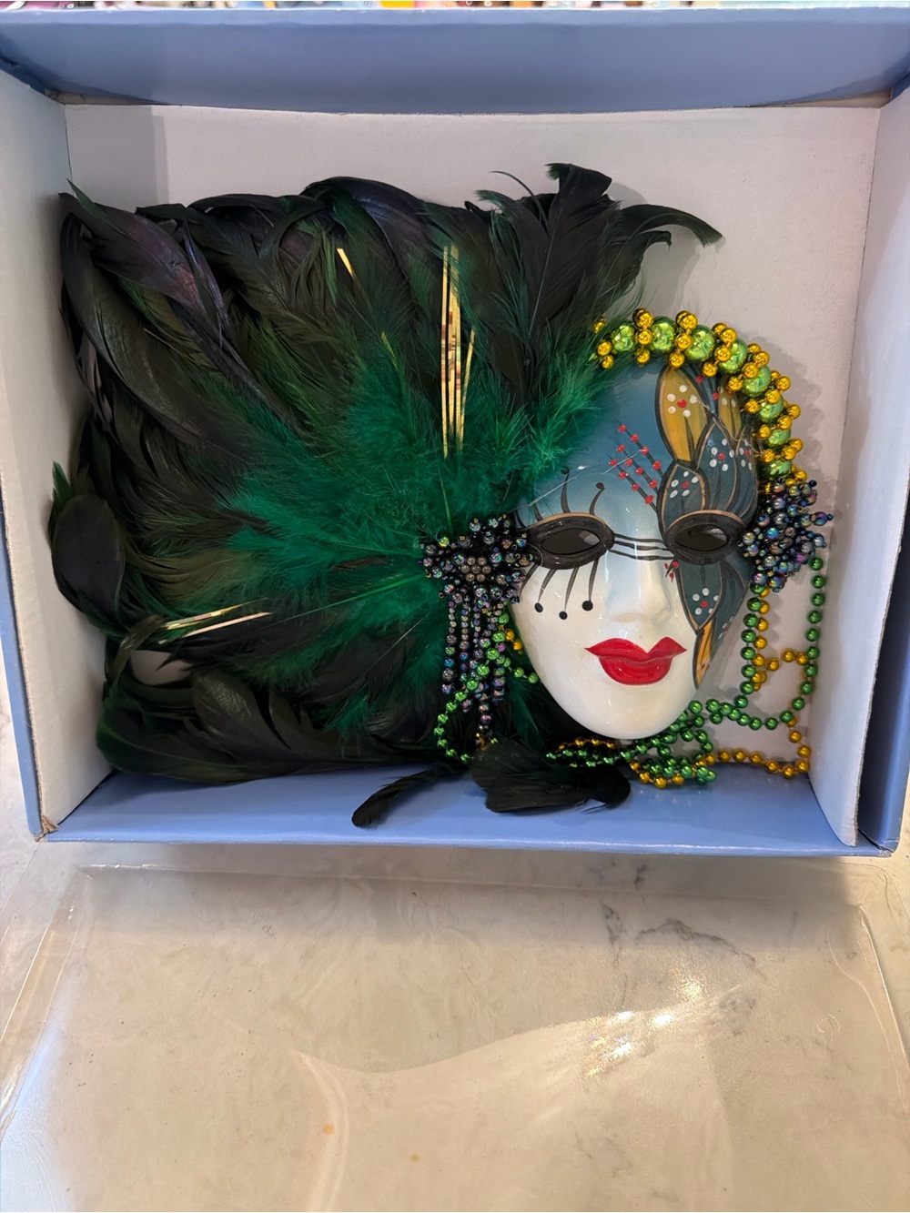 Handheld Feathered Mardi Gras Mask in Black and Green
